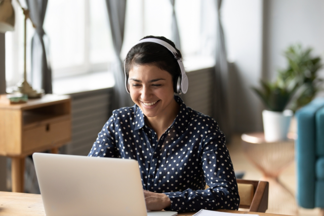stock-photo-happy-indian-young-girl-student-wear-headphone-watch-webinar-listen-online-course-communicate-by-1606120012-transformed(1)